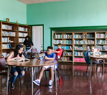 Students reading in a community library